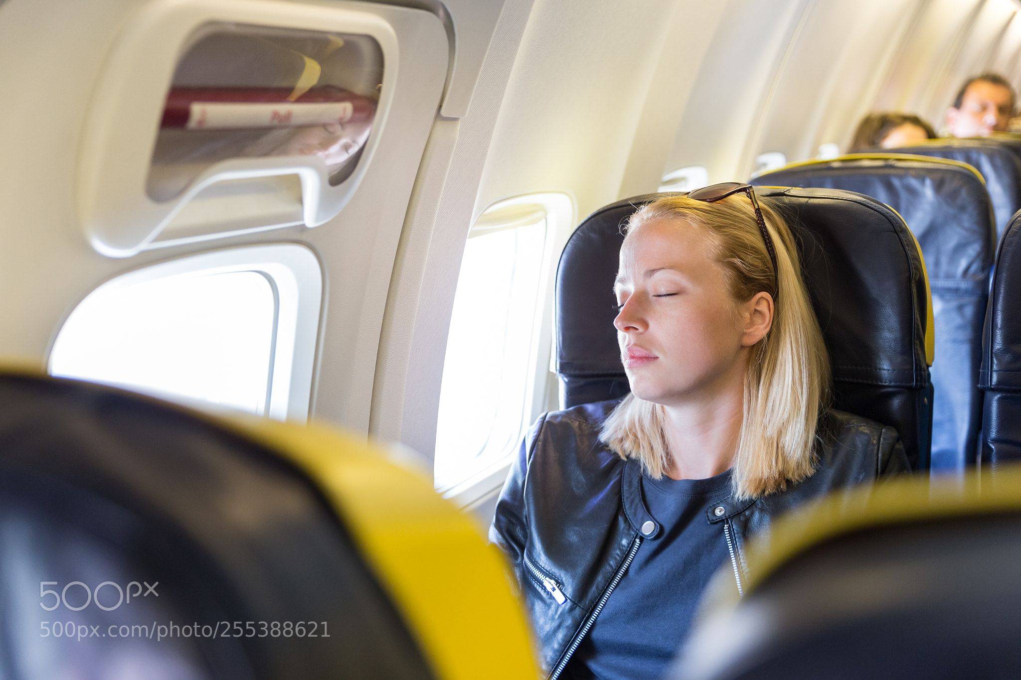 a girl sleeping in plane