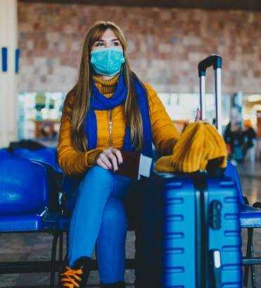a woman at the airport wearing mask